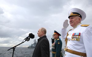 Vladimir Putin with Sergei Shoigu and Nikolai Yevmenov salutes before the main naval parade marking Russian Navy Day