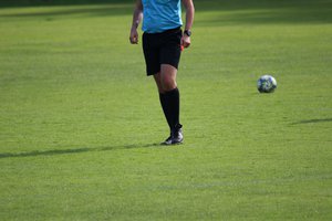 Referee on football pitch