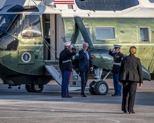 File: Joe Biden salutes a pair of Marines as he disembarks from Marine One at Bradley Air National Guard Base in East Granby, Connecticut Oct. 15, 2021