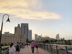 Pedestrians walking along Yamashita Rinko Promenade in Yokohama, Japan.