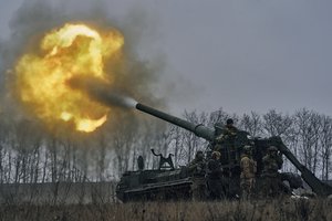 Ukrainian soldiers fire a Pion artillery system at Russian positions near Bakhmut, Donetsk region, Ukraine, Friday, Dec. 16, 2022.