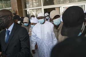 Adama Barrow leaves the polling station after casting his vote in Gambia’s presidential elections