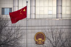 A Chinese flag flies outside of the Secondary Intermediate People's Court of Tianjin northeastern China's Tianjin municipality, Wednesday, Dec. 26, 2018.