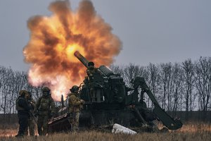 Ukrainian soldiers fire a Pion artillery system at Russian positions near Bakhmut, Donetsk region, Ukraine, Friday, Dec. 16, 2022