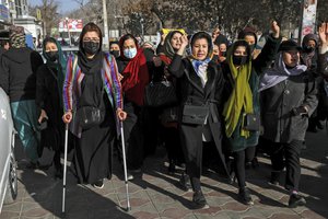 Afghan women chant slogans during a protest against the ban on university education for women, in Kabul, Afghanistan, Thursday, Dec. 22, 2022. 