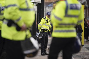 Police patrols outside the stadium ahead the English Premier League soccer match between Manchester United and Chelsea, at Old Trafford Stadium, Manchester, England, Thursday, April, 2022.