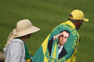 FILE - Supporters gather to meet outgoing President Jair Bolsonaro in his final days outside the official residence Alvorada Palace, in Brasilia, Brazil, Wednesday, Dec. 21, 2022.