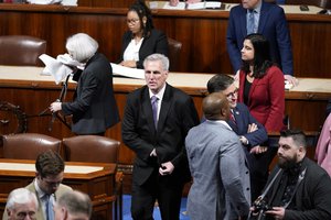 Rep. Kevin McCarthy, R-Calif., walks on the floor after the House voted to adjourn for the evening in the House chamber as the House meets for a second day to elect a speaker and convene the 118th Congress in Washington, Wednesday, Jan. 4, 2023