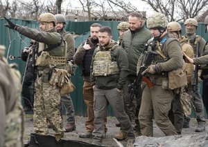 File - Ukrainian President Volodymyr Zelenskyy examines the site of a recent battle in Bucha close to Kyiv, Ukraine on April 4, 2022.