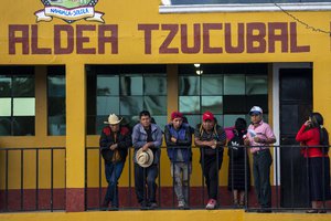 Relatives of Pascual Melvin Guachiac and Wilmer Tulul, attend a community meeting in Tzucubal, Guatemala, Wednesday, June 29, 2022