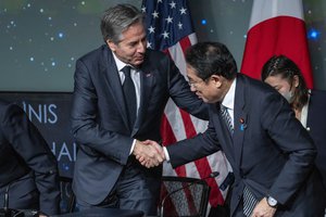 Secretary of State Antony Blinken, left, shakes hands with Japanese Prime Minister Fumio Kishida after an event to sign an agreement on space cooperation at NASA headquarters, Friday, Jan. 13, 2023, in Washington.