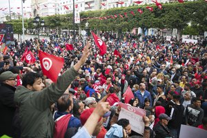 Tunisian demonstrators gather during a rally in support of Tunisian President Kais Saied in Tunis, Tunisia, Sunday, May 8, 2022.