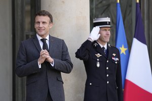 French President Emmanuel Macron reacts as he waits for Swedish Prime Minister Ulf Kristersson, Tuesday, Jan. 3, 2023 at the Elysee Palace in Paris.