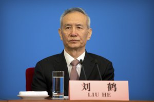 In this Tuesday, March 20, 2018, file photo, Vice Premier Liu He attends a press conference after the closing session of China's National People's Congress (NPC) at the Great Hall of the People in Beijing