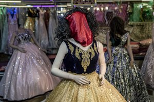 A mannequin's head is covered in a woman dress shop in Kabul, Afghanistan, Monday, Dec. 26, 2022.