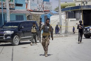 FILE - Security forces patrol at the scene, after gunmen stormed the Hayat Hotel in the capital Mogadishu, Somalia on Aug. 21, 2022.