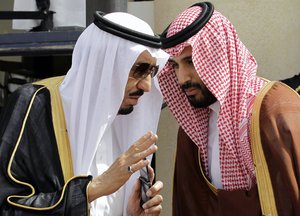 Crown Prince Salman bin Abdul-Aziz Al Saud, left, speaks with his son Prince Mohammed as they wait for Gulf Arab leaders ahead of the opening of Gulf Cooperation Council, also known as GCC summit, in Riyadh, Saudi Arabia