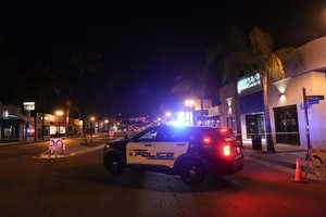 A police vehicle is seen near a scene where a shooting took place in Monterey Park, Calif., Sunday, Jan. 22, 2023.