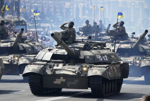 File - Tanks ride along Khreshchatyk Street, during a military parade to celebrate Independence Day in Kiev, Ukraine, Tuesday, Aug. 24, 2021.