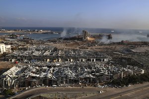 FILE - Smoke rises from the scene of an explosion that hit the seaport of Beirut, Lebanon, Wednesday, Aug. 5, 2020.