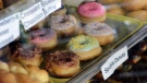 Doughnuts are seen for sale at Summit Donuts & Kolaches in Summit, Miss., on Wednesday, Aug. 4, 2021. When Saly Som learned about an opportunity to buy the doughnut shop three years ago, she cashed in her savings she and her family had earned, sold everything and moved her family across the country, fulfilling a dream of becoming a business owner in America. (Matt Willamson /The Enterprise-Journal via AP)