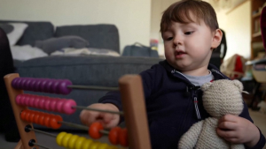 In this still image from a video, four-year-old Teddy Hobbs counts on an abacus. (BBC via Reuters)