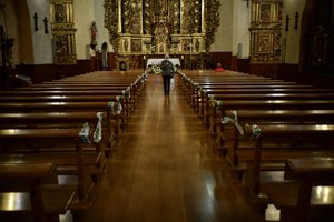 A Devotee wearing a face mask to protect against the coronavirus leaves the church in Lumbier, northern Spain, Sunday, June 7, 2020.