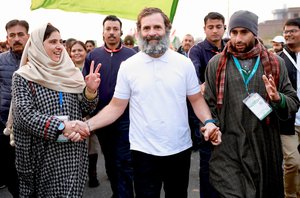 India's opposition Congress party leader Rahul Gandhi, center in white T-shirt, walks with his supporters during a 5-month-long “Unite India March,” in Jammu, India,23 Jan, 2023.