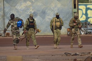 FILE - This undated photograph handed out by French military shows three Russian mercenaries, right, in northern Mali.