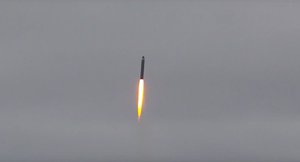 In this handout photo taken from video released by Russian Defense Ministry Press Service on Wednesday, Oct. 26, 2022, a Sineva intercontinental ballistic missile is test-fired as part of Russia's nuclear drills by a Russian nuclear submarine from the Barents Sea.