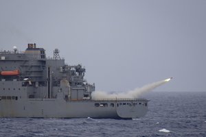 File - A remote controlled drone launches from the flight deck of the dry cargo and ammunition ship USNS Matthew Perry (T-AKE 9) during a missile exercise (MSLEX) in the Philippine Sea, March 16, 2019. MSLEXs are designed to increase the tactical proficiency, lethality, and interoperability of participating units in an era of great power competition.