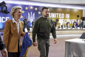 European Commission President Ursula von der Leyen with a Ukrainian flag and Ukrainian President Volodymyr Zelenskyy during the EU-Ukraine summit in Kyiv, Ukraine, Thursday, Feb. 2, 2023.