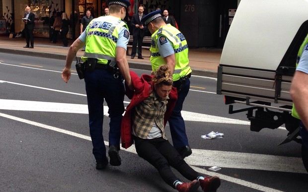 Police arrest protesters at the demonstration in Wellington