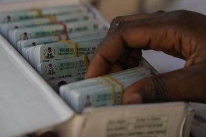 An electoral official checks permanent voters cards at a distribution centre in Lagos, ahead of Feb. 2023 Presidential elections in Lagos, Nigeria, Wednesday, Jan. 11, 2023.