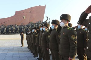 Public Security Forces soldiers salute to the statues of their late leaders Kim Il Sung and Kim Jong Il on the occasion of the 75th founding anniversary of the Korean People's Army in Pyongyang, North Korea Wednesday, Feb. 8, 2023.