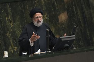 Iranian President Ebrahim Raisi addresses lawmakers while defending his next year's budget bill at the parliament in Tehran, Iran, Sunday, Jan. 22, 2023.