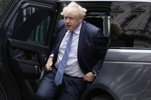 Britain's Prime Minister Boris Johnson returns to Downing Street after the weekly Prime Minister's Questions at the Houses of Parliament in London, Wednesday, May 25, 2022