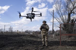 A Ukrainian serviceman aka Zakhar flies a drone during fighting at the frontline near Bakhmut, Ukraine, Friday, March 3, 2023.