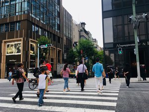 People crossing the intersection at Kojunsha-dori and Ginza 6 streets at Tokyo, Japan.