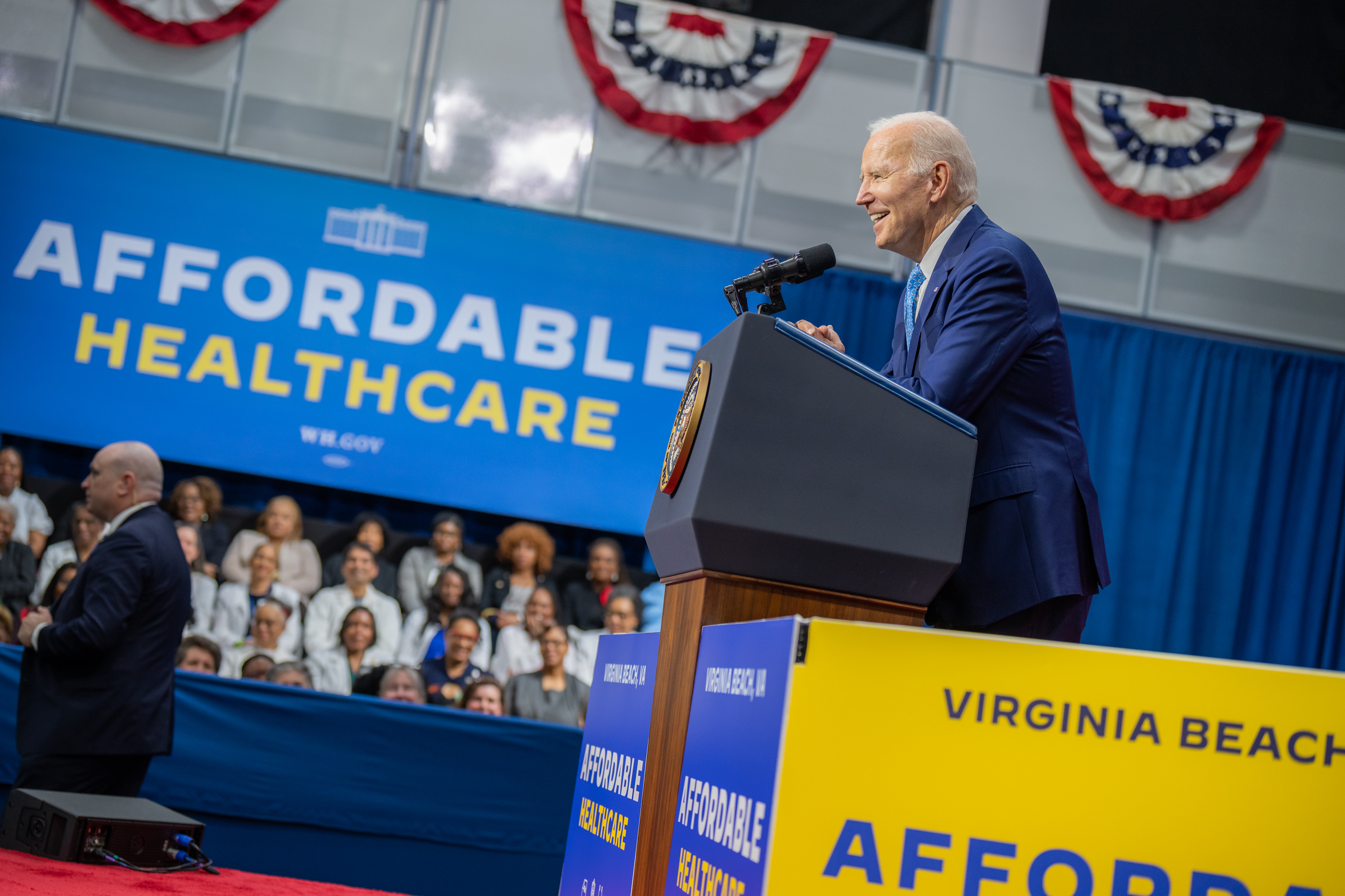 President Biden delivers remarks in front of signage that reads: "Affordable Healthcare."