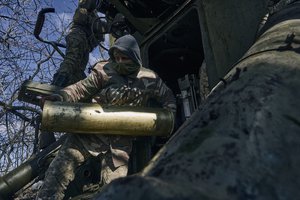 Ukrainian soldiers prepare to fire a self-propelled howitzer towards Russian positions near Bakhmut, Donetsk region, Ukraine, Sunday, March 5, 2023.