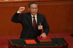 Newly elected Chinese Premier Li Qiang takes his oath during a session of China's National People's Congress (NPC) at the Great Hall of the People in Beijing, Saturday, March 11, 2023