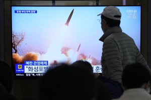 A TV screen shows an image of North Korea's missiles launch during a news program at the Seoul Railway Station in Seoul, South Korea, Friday, March 10, 2023.