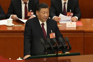 Chinese President Xi Jinping delivers a speech at the closing ceremony for China's National People's Congress (NPC) at the Great Hall of the People in Beijing, Monday, March 13, 2023