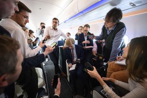 Britain's Prime Minister Rishi Sunak speaks with members of the media onboard a plane bound for San Diego, US to meet with US President Joe Biden and Prime Minister of Australia Anthony Albanese, at London's Stansted Airport, Sunday March 12, 2023.