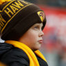 A young Hawthorn fan watches a match in Hobart last year.