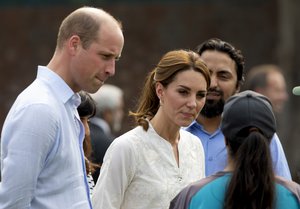 Britain's Prince William and his wife Kate, Duchess of Cambridge meet Pakistani girls during their visit at the Pakistan Cricket Academy in Lahore, Pakistan, Thursday, Oct. 17, 2019.