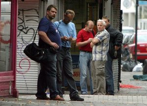 Polish manual workers wait on a street corner for casual employment in west London Friday July 28, 2006. Nearly 300,000 Poles have migrated to Britain since 2004, willing to work for next to nothing. Britain was one of three EU countries, along with Sweden and Ireland, to immediately allow the free flow of workers from new member