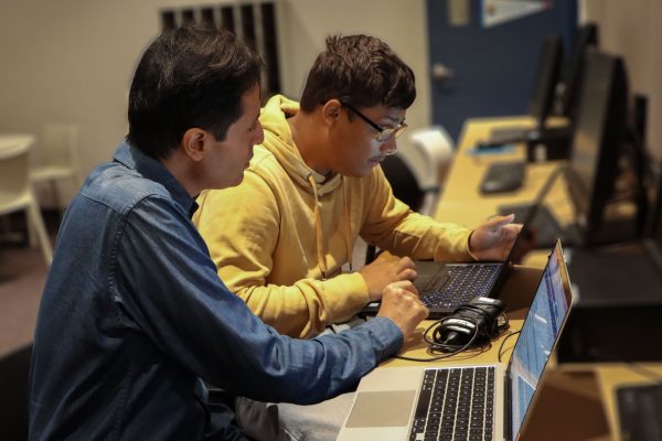 Two students using laptops