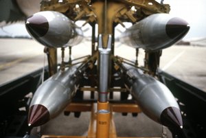 File - A frontal view of four B-61 nuclear free-fall bombs on a bomb cart.